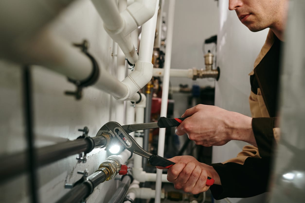 Plumbers maintaining commercial plumbing pipes in Morgan Hill