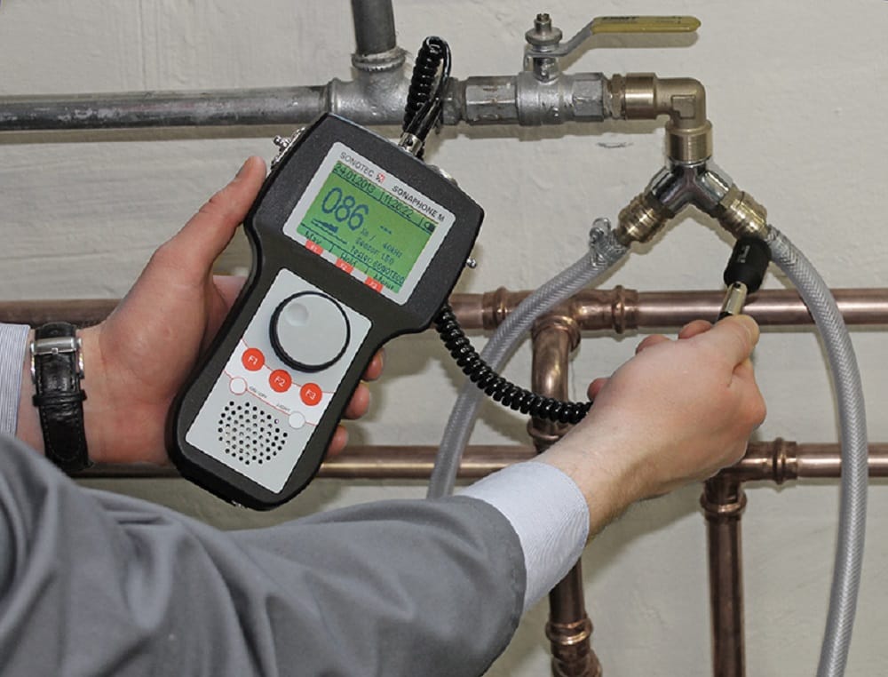Plumber testing pipes with electronic leak detection equipment in Morgan Hill